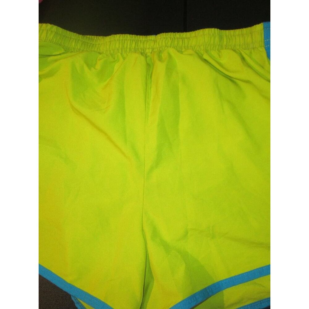 Juniors sz M by Reebok Lime green with lining has white and blue on side